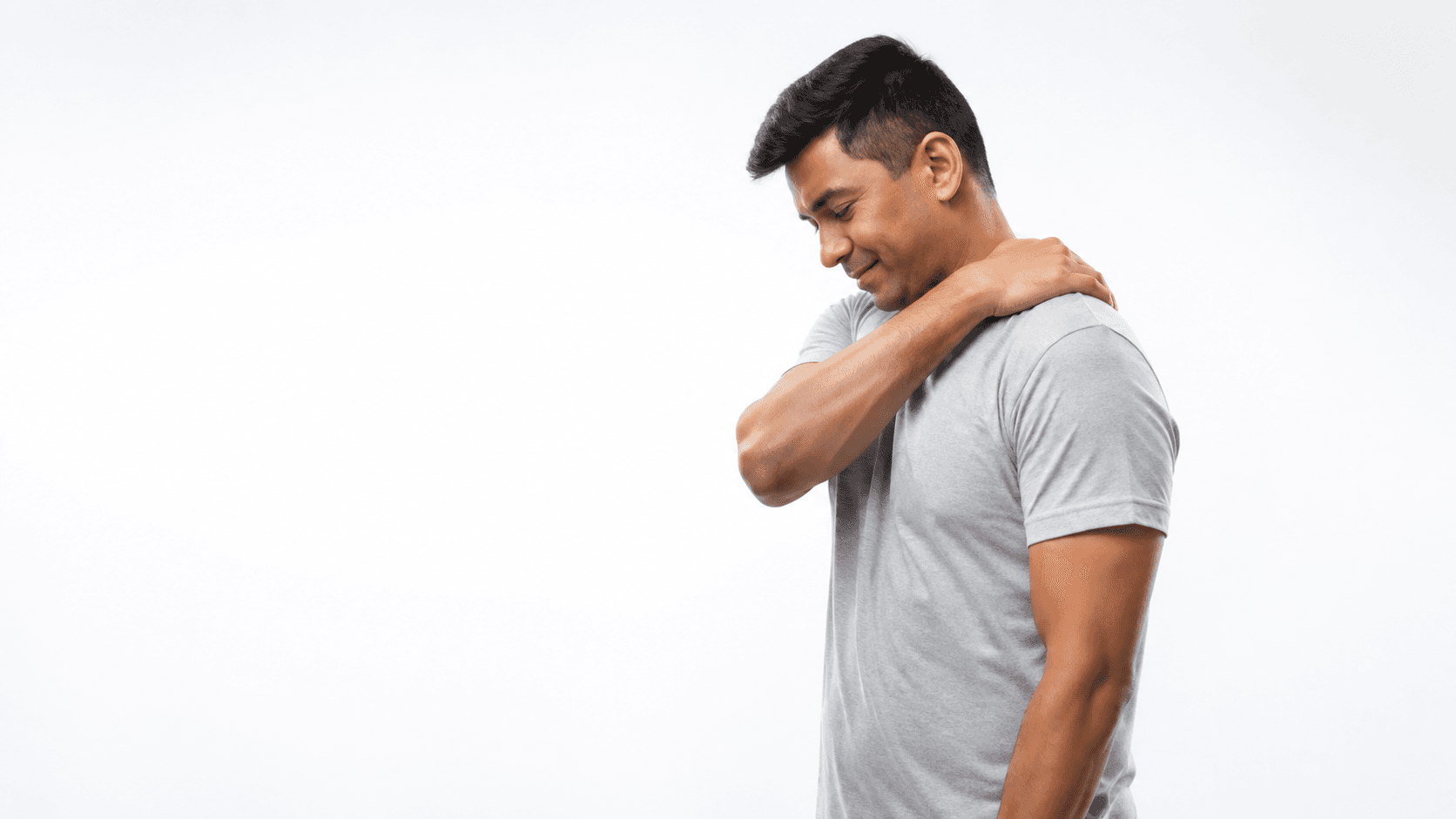 A man holding his neck while experiencing chronic pain